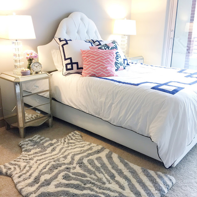 Love this bedroom decor, especially the zebra rug