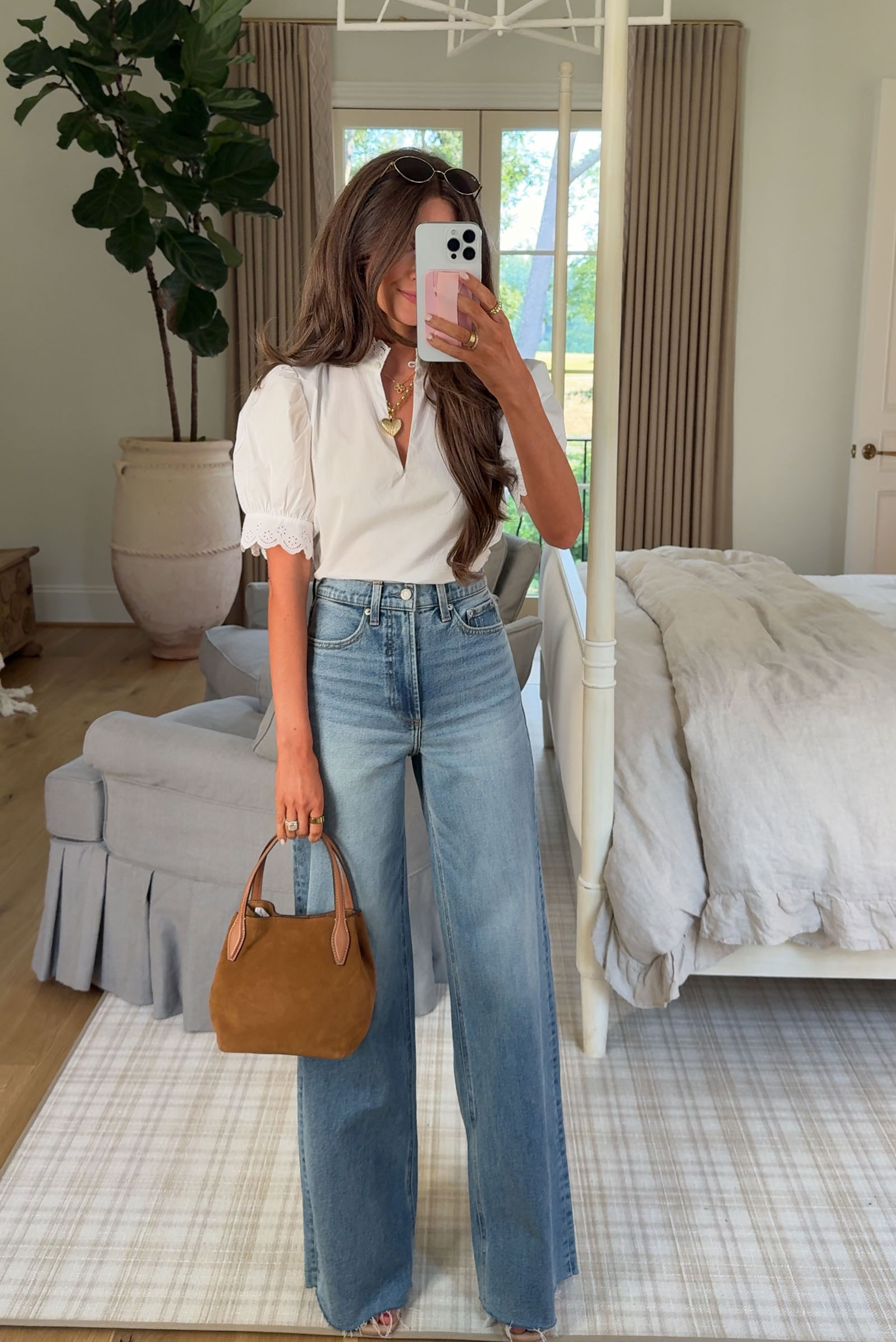 Southern Curls & Pearls wearing Frame Eyelet Inset Top, Paige Anessa High-Waist Raw Hem Wide-Leg Jeans, and Madewell Mini Suede Shopper Tote from the Nordstrom Anniversary Sale 2025.